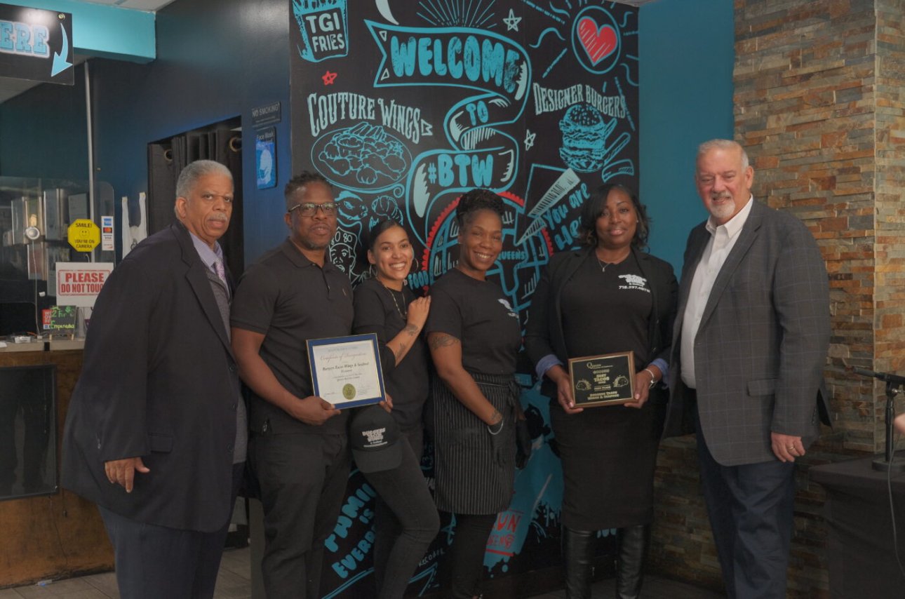 BTW team receiving the Best Tacos in Queens award plaque